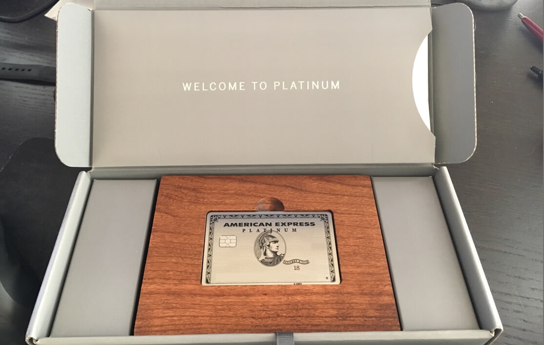 shows amex platinum card inside wooden box package