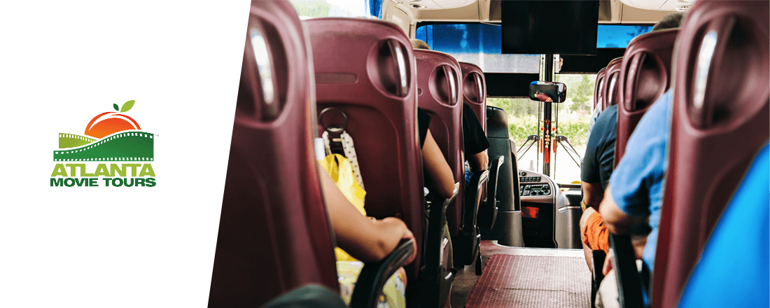 the bus with lots of people sitting and listening to the travel guide