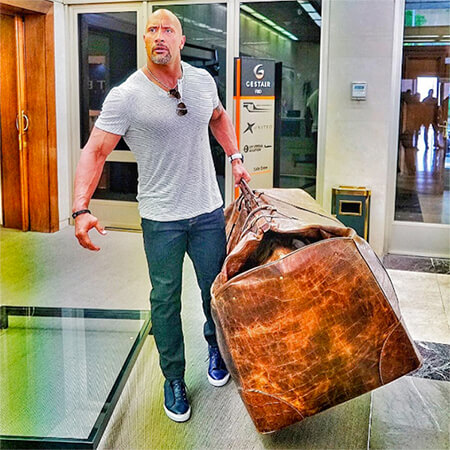 Actor "The Rock" carries huge bag