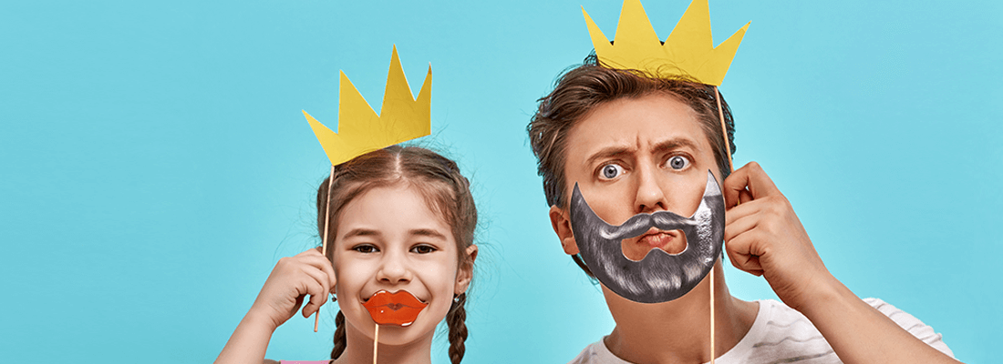 Man and a girl with cardboard crowns