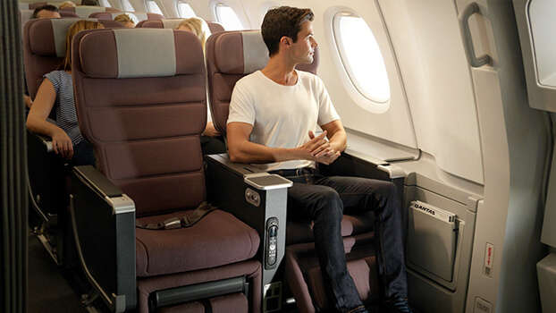 Man flying in premium class seat